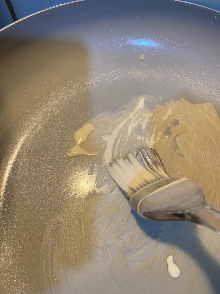 Brush a thin layer of batter onto a non-stick pan using a pastry brush.