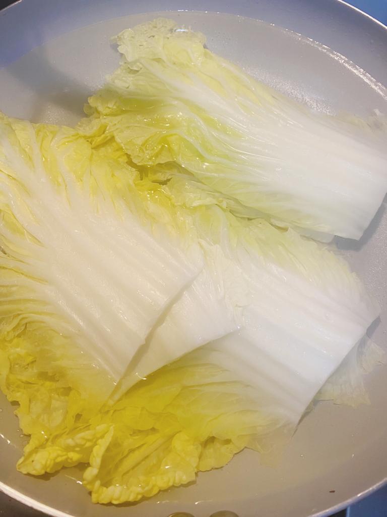 Blanched cabbage leaves prepared for rolling into cabbage wraps