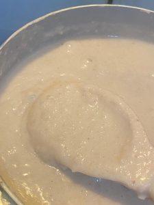 Peanuts and rice blended together in preparation for making creamy Chura Gerteh