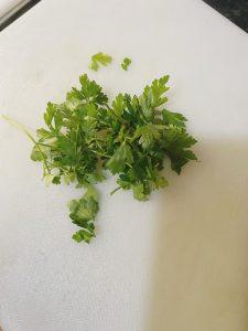 Fresh parsley on a white chopping board