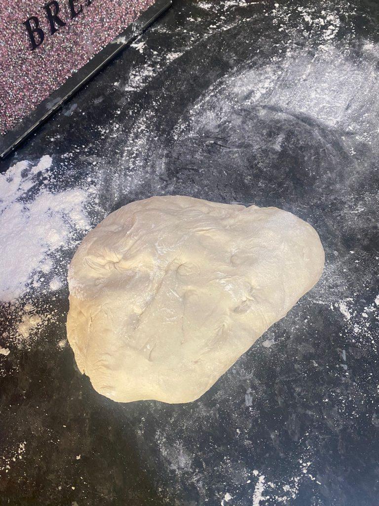 Golden fried dough resting on a plate, ready to be layered with beef and tomato sauce.