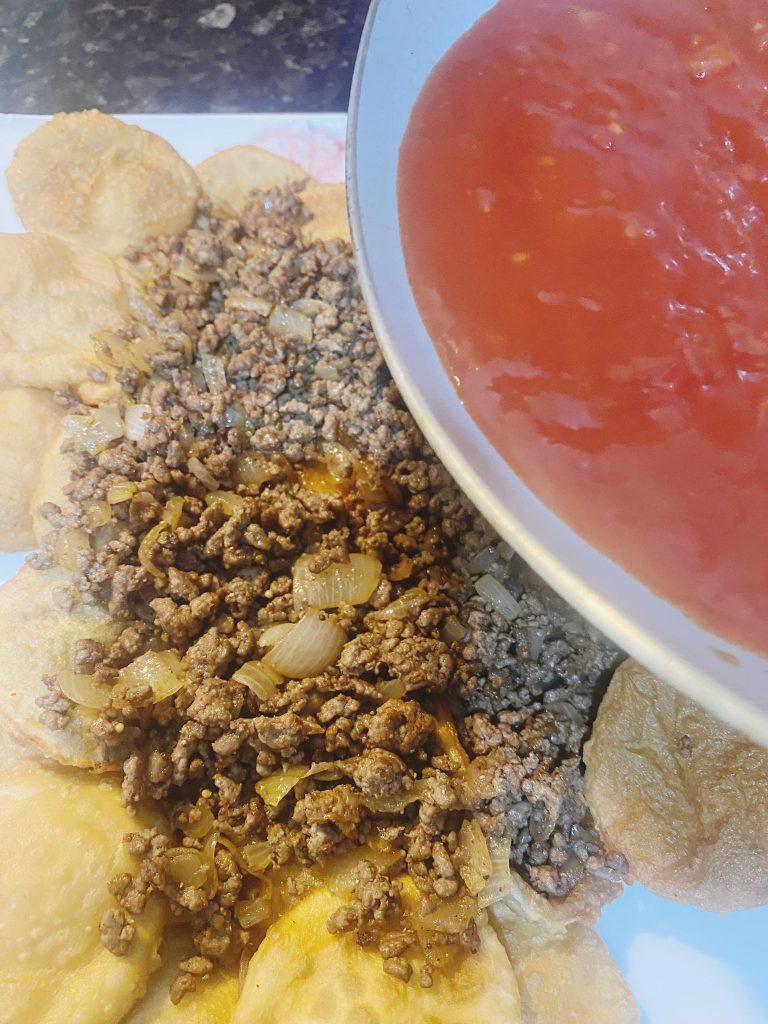 Stacked triple-layered delight with beef filling and creamy tomato sauce.