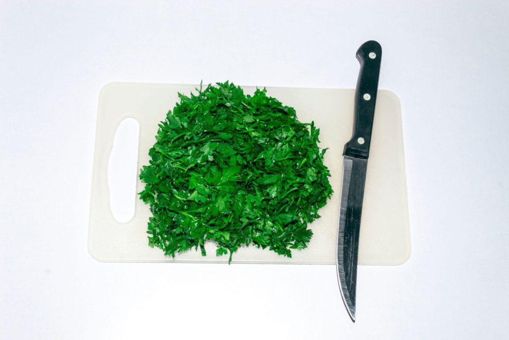 Freshly chopped parsley in a small bowl ready to use