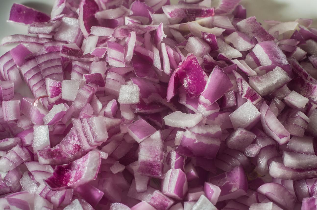 Finely chopped red onion pieces for tuna or avocado toast filling
