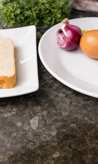 Eggs and red onion prepared as ingredients for avocado toast