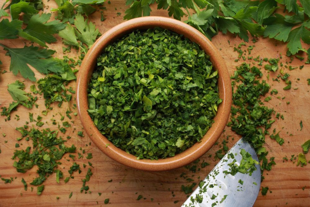Close-up of finely chopped parsley with bright green color