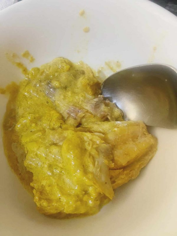 Mashed canned mackerel in a bowl prepared for creamy mackerel rillettes sandwich filling