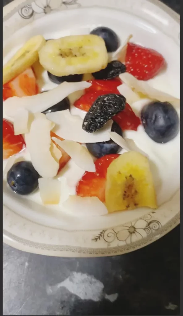Mixed fruit blend added on top of yogurt and fresh berries.