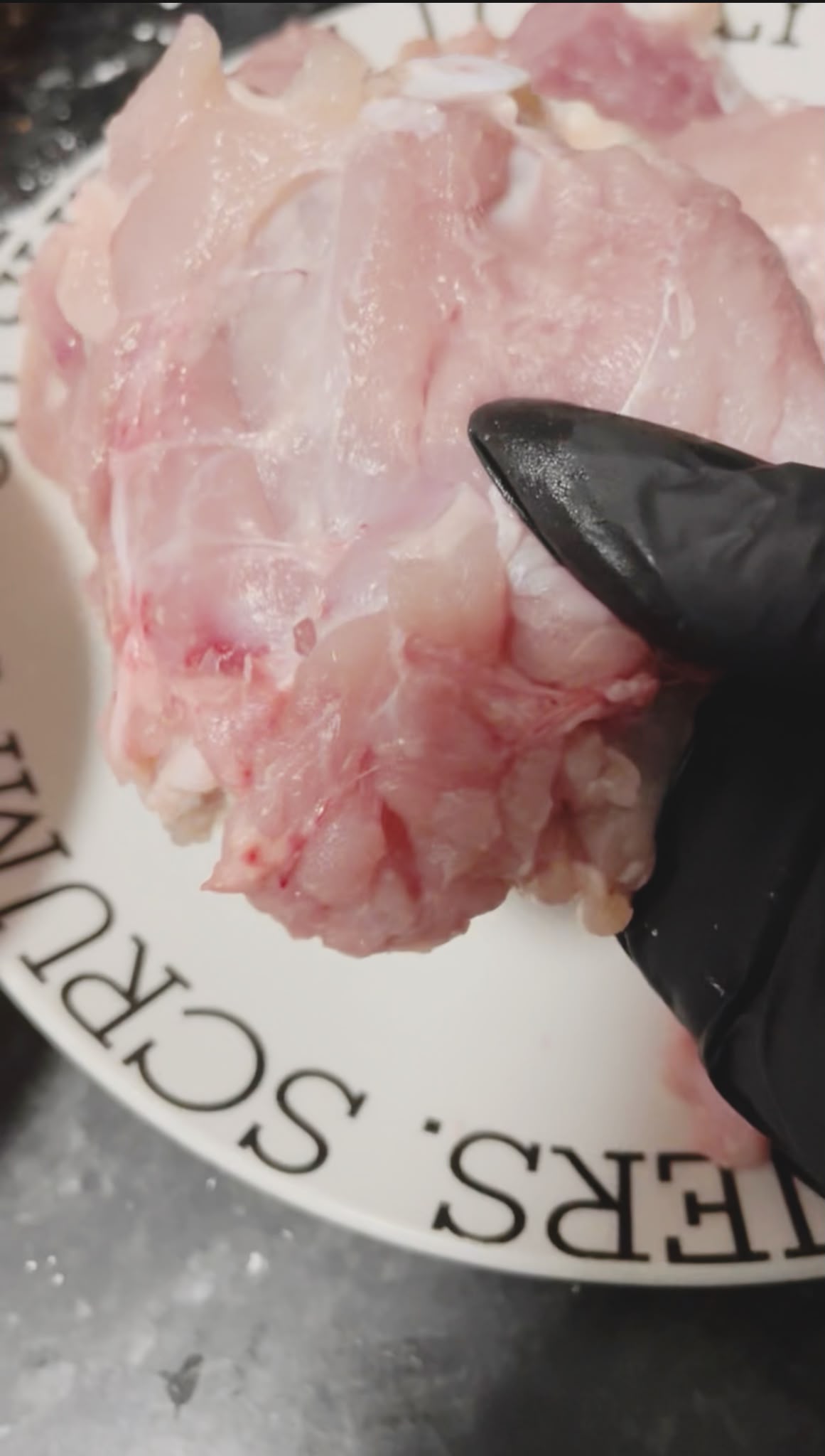 Preparing boneless chicken thighs for crispy chicken and prawn salad